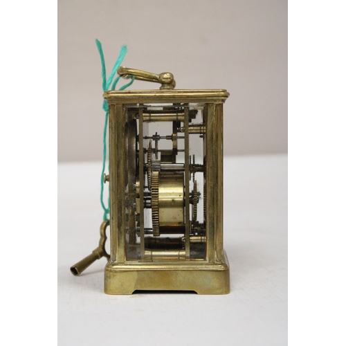 31 - AN AIG LE REVEIL CARRIAGE CLOCK WITH FACETTED GLASS PANELS NO. 12685 WITH KEY