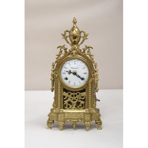 36 - A FRANZ HERMLE GILT BRONZE BOUDOIR CLOCK IN THE BAROQUE STYLE DECORATED WITH SCROLLING ACANTHUS, A G... 