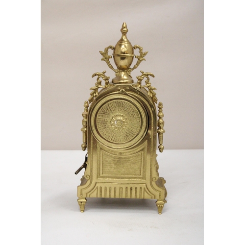 36 - A FRANZ HERMLE GILT BRONZE BOUDOIR CLOCK IN THE BAROQUE STYLE DECORATED WITH SCROLLING ACANTHUS, A G... 