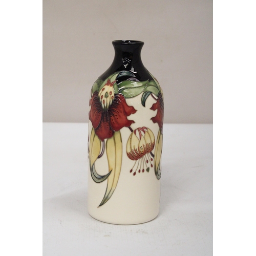 38 - A MOORCROFT ANNA LILY MILK VASE SIGNED K. GOODWIN - 25 CM