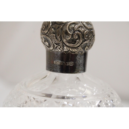 44 - A HALLMARKED LONDON SILVER AND CUT GLASS PERFUME BOTTLE