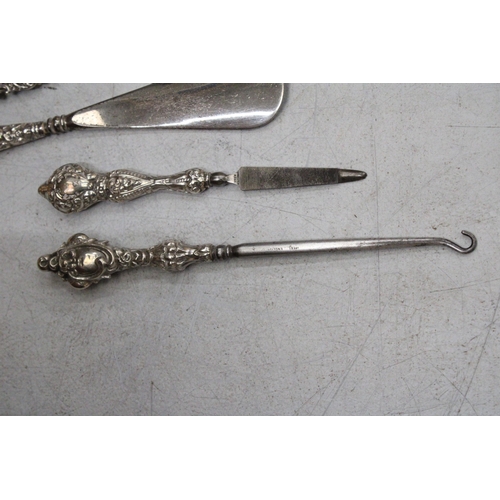 46 - A QUANTITY OF HALLMARKED BIRMINGHAM SILVER HANDLED ITEMS TO INCLUDE A BUTTON HOOK, NAIL FILE, NAIL B... 