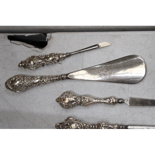 46 - A QUANTITY OF HALLMARKED BIRMINGHAM SILVER HANDLED ITEMS TO INCLUDE A BUTTON HOOK, NAIL FILE, NAIL B... 