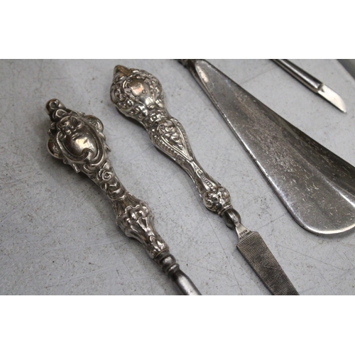 46 - A QUANTITY OF HALLMARKED BIRMINGHAM SILVER HANDLED ITEMS TO INCLUDE A BUTTON HOOK, NAIL FILE, NAIL B... 