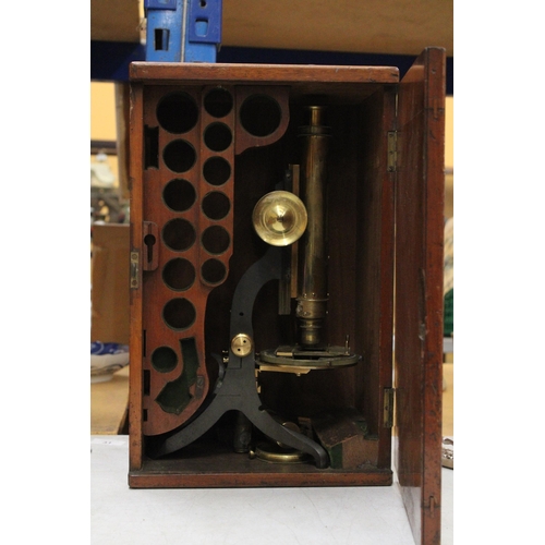 48 - A VINTAGE BRASS MICROSCOPE IN A MAHOGANY CASE