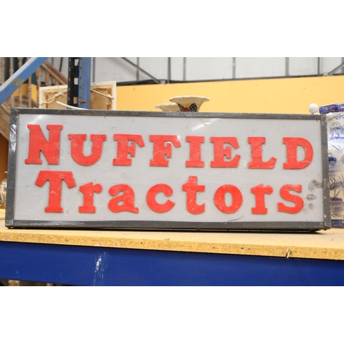 72 - AN ILLUMINATED NUFFIELD TRACTORS SIGN - 74 X 27 CM