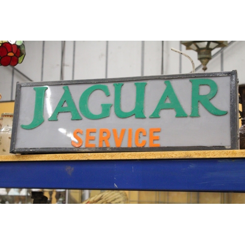 73 - AN ILLUMINATED JAGUAR SERVICE SIGN - 87 X 22.5 CM