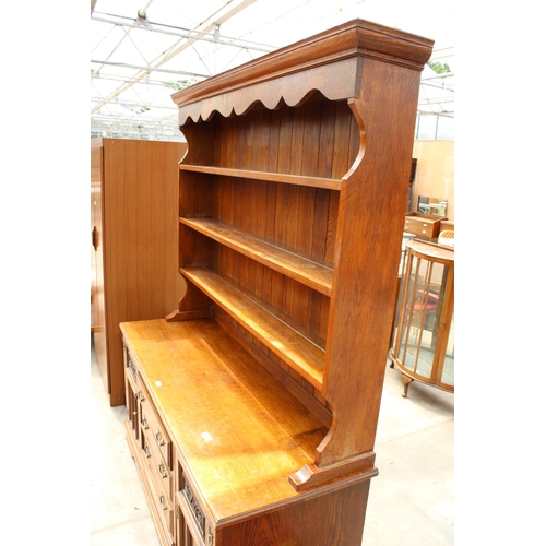 2823 - A LATE VICTORIAN OAK DRESSER WITH DRAWERS AND CUPBOARD TO BASE AND PLATE RACK, 61