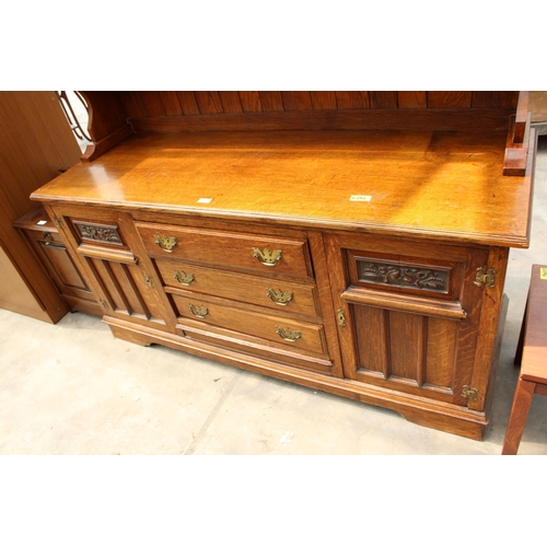 2823 - A LATE VICTORIAN OAK DRESSER WITH DRAWERS AND CUPBOARD TO BASE AND PLATE RACK, 61