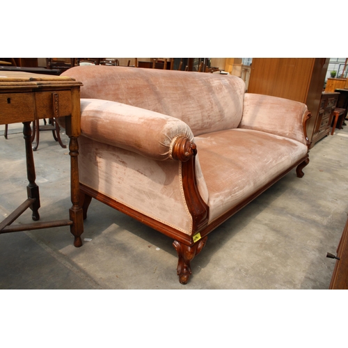 2825 - A VICTORIAN MAHOGANY CARVED SCROLL END SOFA ON SHORT CABRIOLE LEGS