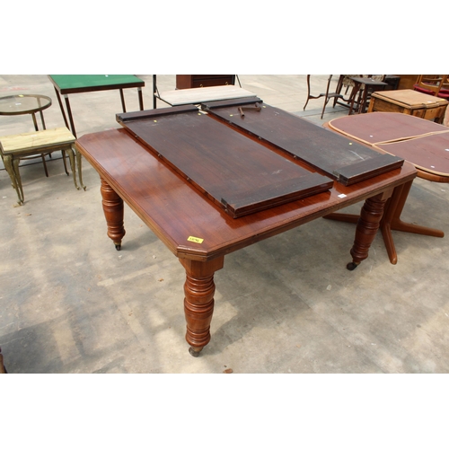 2828 - A LATE VICTORIAN MAHOGANY WIND-OUT DINING TABLE ON TURNED LEGS WITH CANTED CORNERS, 56