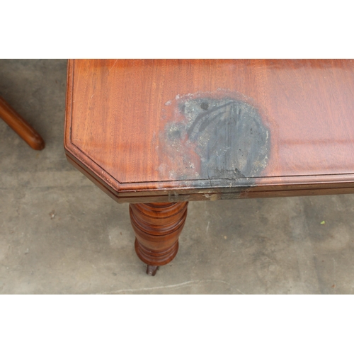 2828 - A LATE VICTORIAN MAHOGANY WIND-OUT DINING TABLE ON TURNED LEGS WITH CANTED CORNERS, 56