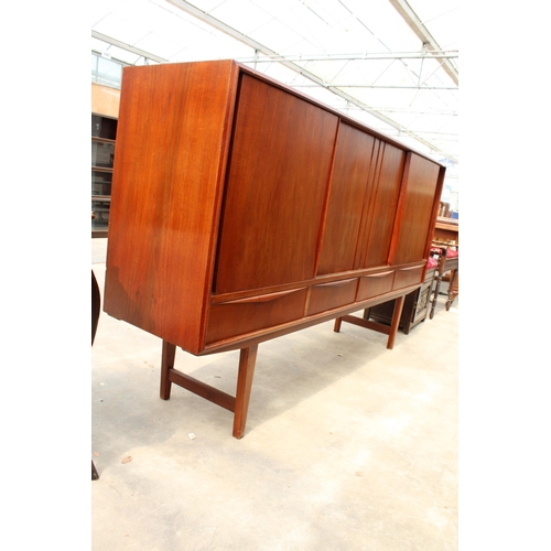 2831 - A RETRO TEAK SIDEBOARD ON OPEN BASE ENCLOSING FOUR DRAWERS AND FOUR SLIDING DOORS, 77