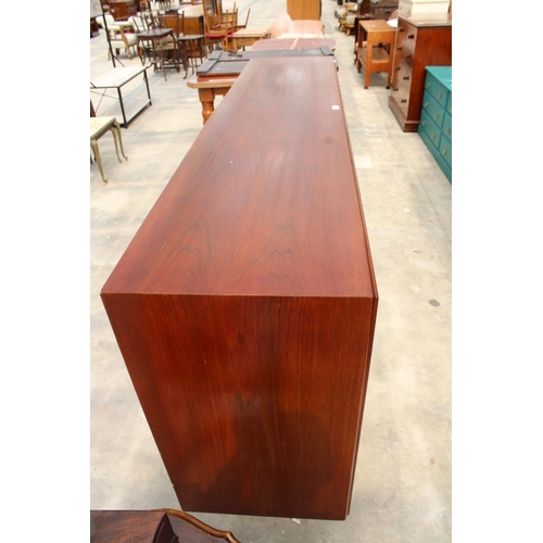 2831 - A RETRO TEAK SIDEBOARD ON OPEN BASE ENCLOSING FOUR DRAWERS AND FOUR SLIDING DOORS, 77