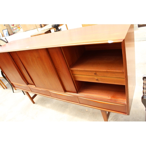 2831 - A RETRO TEAK SIDEBOARD ON OPEN BASE ENCLOSING FOUR DRAWERS AND FOUR SLIDING DOORS, 77