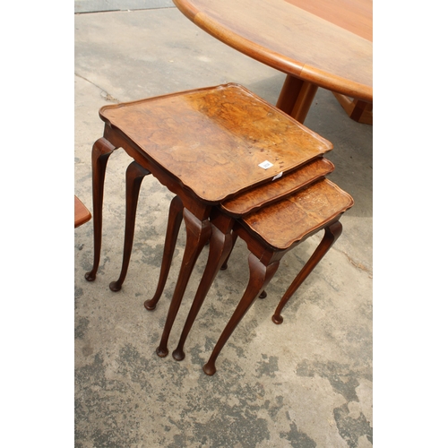 2838 - A NEST OF THREE WALNUT TABLES ON CABRIOLE LEGS