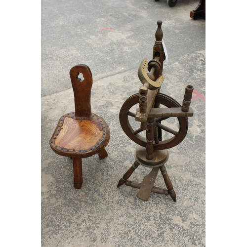 2855 - A VINTAGE WOODEN SPINNING WHEEL AND CHAIR