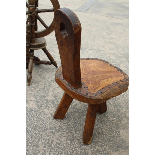 2855 - A VINTAGE WOODEN SPINNING WHEEL AND CHAIR