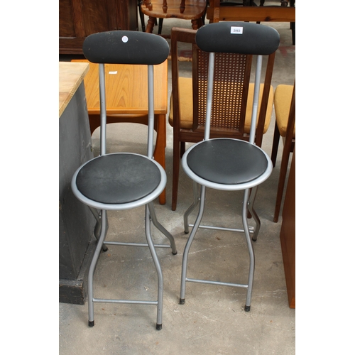 2863 - A PAIR OF TUBULAR FRAMED FOLDING STOOLS WITH HIGH BACKS