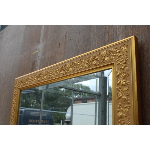 2874 - A GILT EFFECT BEVEL EDGE WALL MIRROR WITH FOLIATE DECORATION, 42