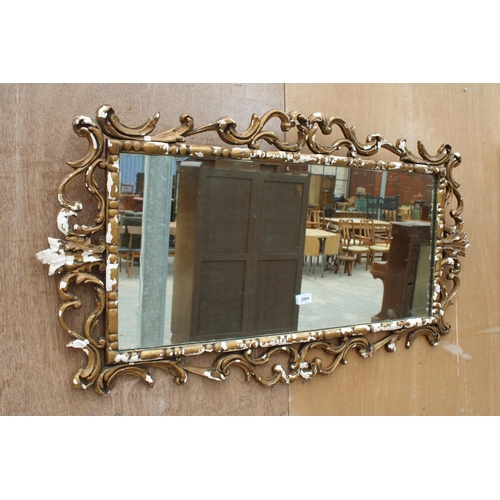 2884 - A ROCOCO STYLE GILT FRAMED WALL MIRROR, 46