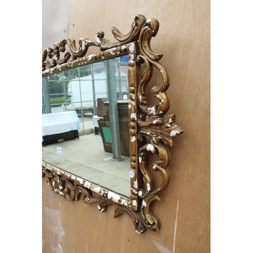 2884 - A ROCOCO STYLE GILT FRAMED WALL MIRROR, 46