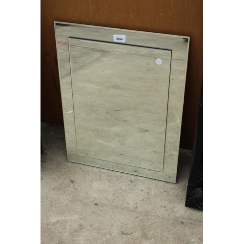 2894 - A STEPPED UNFRAMED WALL MIRROR, 24