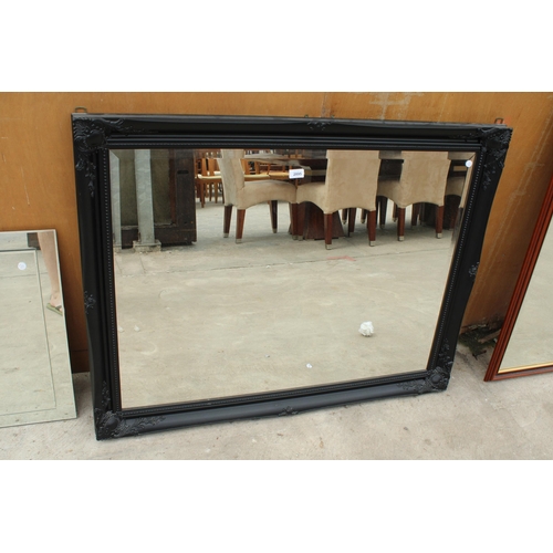 2895 - AN ARQADIA BLACK FRAMED WALL MIRROR, 46