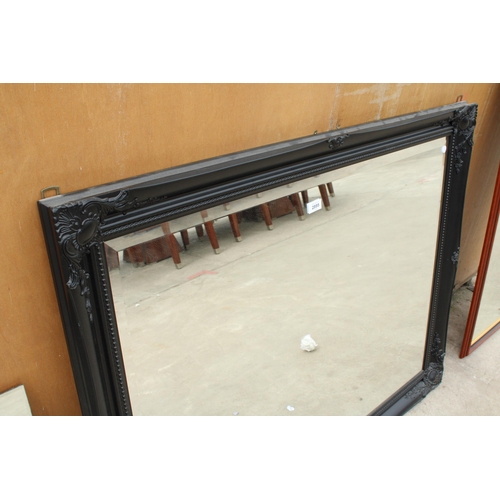 2895 - AN ARQADIA BLACK FRAMED WALL MIRROR, 46