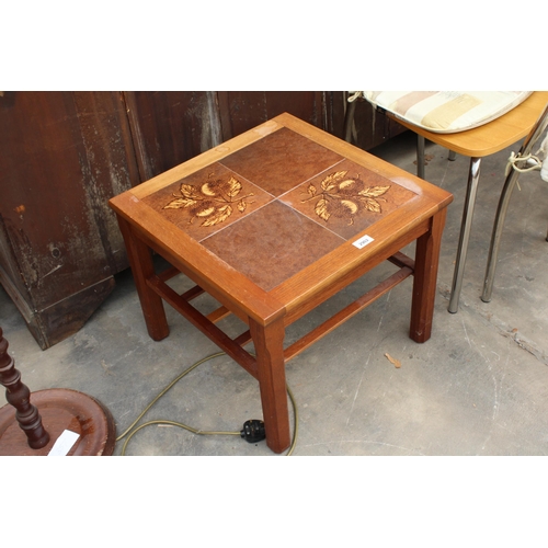 2902 - A RETRO TEAK LAMP TABLE WITH TILED TOP AND MAGAZINE SHELF, 19.5