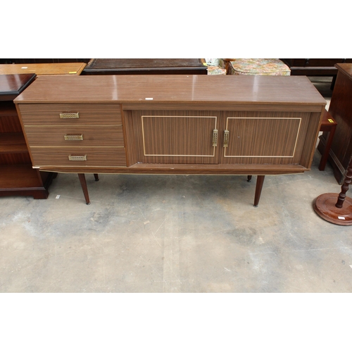 2904 - A RETRO WALNUT EFFECT SIDEBOARD ON TAPERING LEGS ENCLOSING THREE DRAWERS AND TWO CUPBOARDS, 66