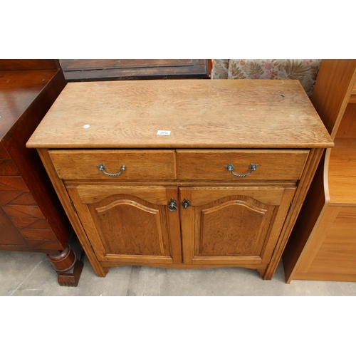 2910 - AN OAK SIDEBOARD ENCLOSING TWO DRAWERS AND TWO CUPBOARDS, 36