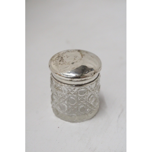 59 - THREE HALLMARKED CHESTER, BIRMINGHAM AND LONDON SILVER LIDDED ITEMS TO INCLUDE A SCENT BOTTLE AND TW... 