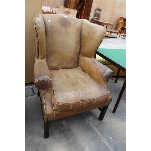 2928 - A GEORGE III STYLE WINGED LEATHER LOUNGE CHAIR