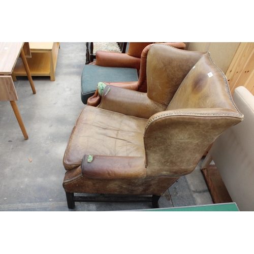 2928 - A GEORGE III STYLE WINGED LEATHER LOUNGE CHAIR