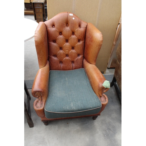 2929 - A GEORGE III STYLE WINGED LEATHER LOUNGE CHAIR