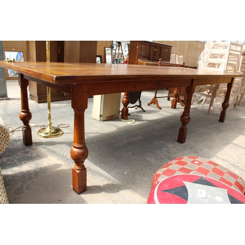 2944 - AN OAK TEN PLANK TOP REFECTORY TABLE ON SIX TURNED LEGS, 10