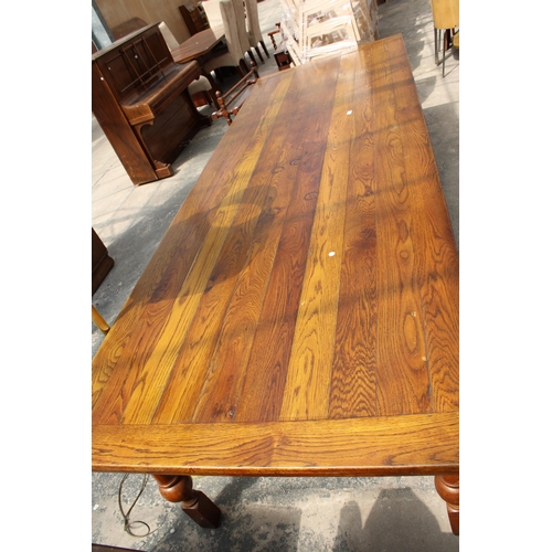 2944 - AN OAK TEN PLANK TOP REFECTORY TABLE ON SIX TURNED LEGS, 10