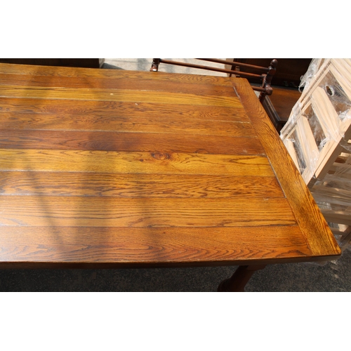 2944 - AN OAK TEN PLANK TOP REFECTORY TABLE ON SIX TURNED LEGS, 10