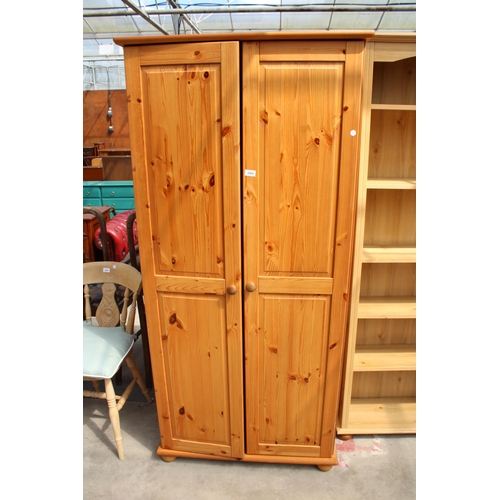 2965 - A MODERN PINE TWO DOOR WARDROBE, 34