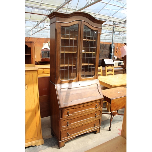 2976 - AN EARLY 20TH CENTURY OAK BUREAU BOOKCASE WITH GLAZED AND LEADED UPPER PORTION, 37