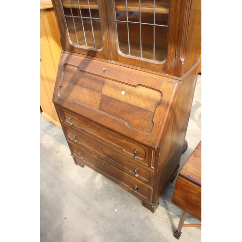 2976 - AN EARLY 20TH CENTURY OAK BUREAU BOOKCASE WITH GLAZED AND LEADED UPPER PORTION, 37