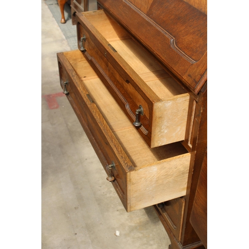 2976 - AN EARLY 20TH CENTURY OAK BUREAU BOOKCASE WITH GLAZED AND LEADED UPPER PORTION, 37