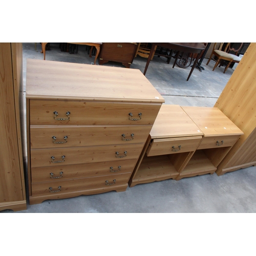 2989 - A MODERN PINE EFFECT BEDROOM SUITE COMPRISING TWO WARDROBES, CHEST OF FIVE DRAWERS AND A PAIR OF BED... 