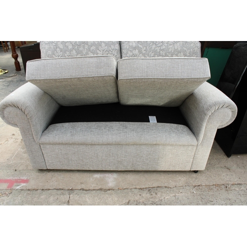 3000 - A MODERN GREY FLORAL TWO SEATER SETTEE AND TWO LOOSE FLORAL CUSHIONS