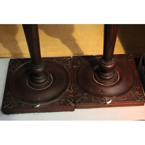 60 - A PAIR OF WOOD AND COPPER LAMP BASES WITH FLAME SHADES