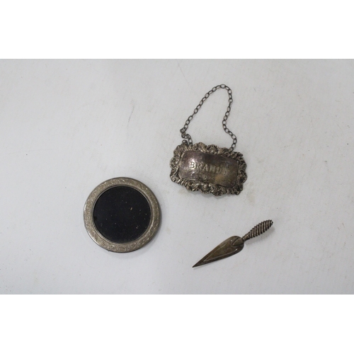 67 - THREE HALLMARKED SILVER ITEMS TO INCLUDE A BRANDY DECANTER LABLE, MINIATURE ROUND PHOTOFRAME AND A T... 