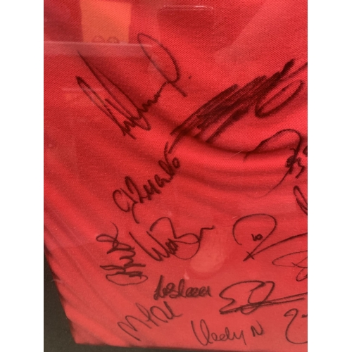 77 - A SIGNED MANCHESTER UNITED FOOTBALL SQUAD PLAYER'S T-SHIRT DATED 10/2/08 WITH CERTIFICATE OF AUTHENT... 