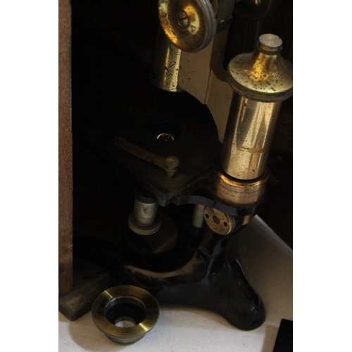 64 - A BRASS MAHOGANY CASED MICROSCOPE