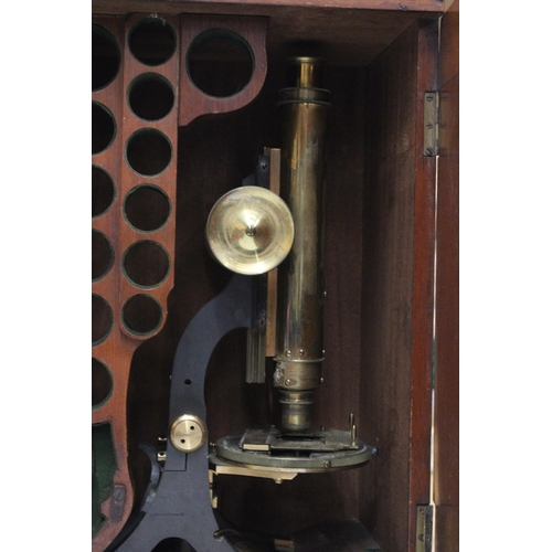 48 - A VINTAGE BRASS MICROSCOPE IN A MAHOGANY CASE